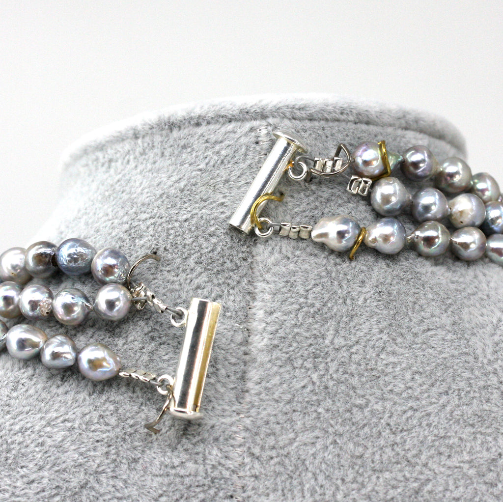 Necklace of Grey Triple Strand with inlaid freshwater pearls.