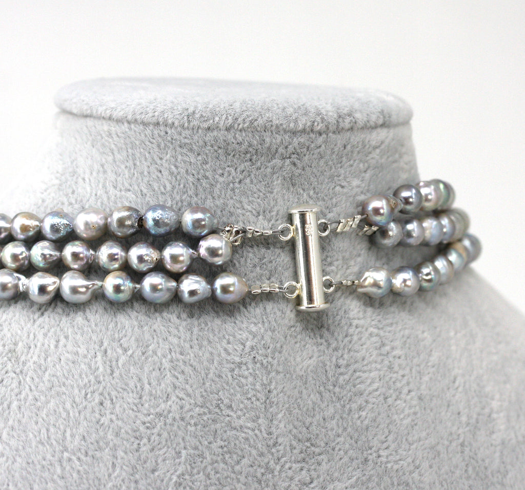 Necklace of Grey Triple Strand with inlaid freshwater pearls.