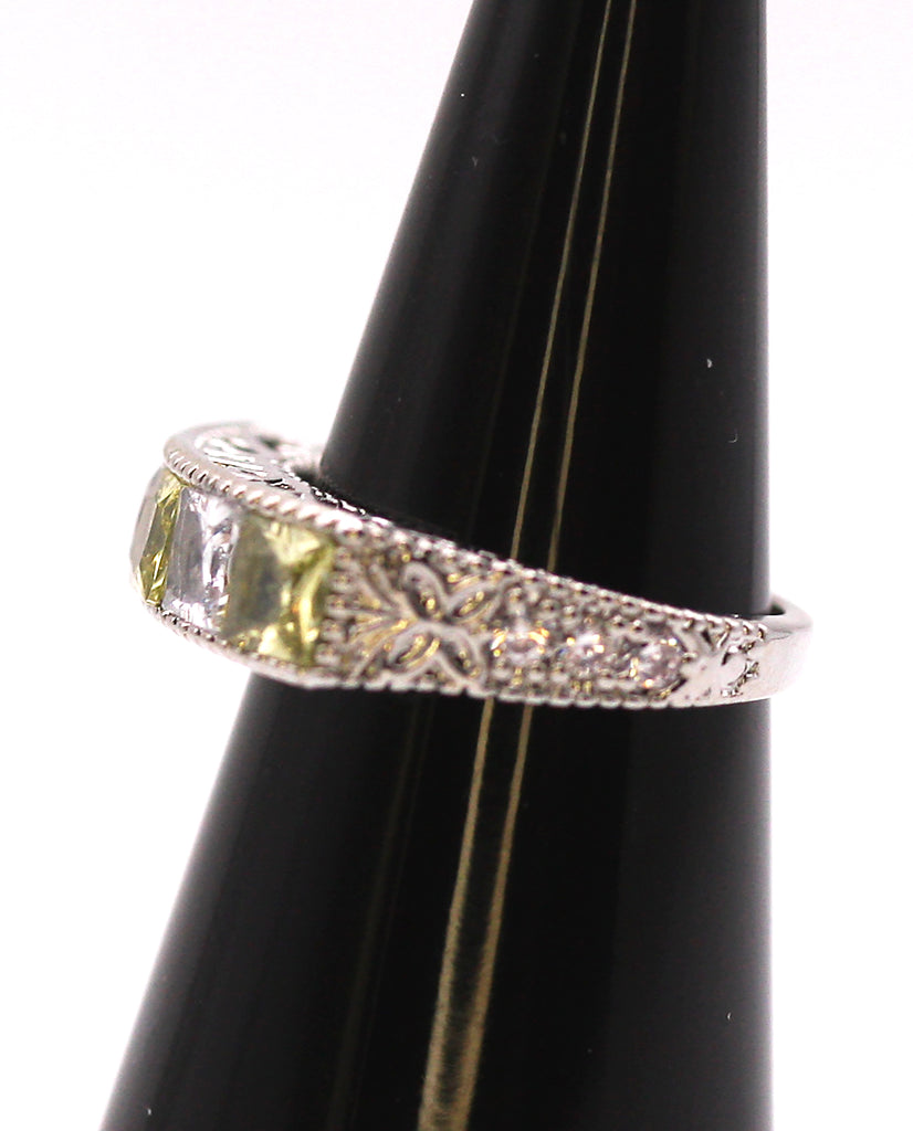 Women's Ring Silver/Rhodium Plated with Perido Green and Clear Zircon Gemstones . Side view.