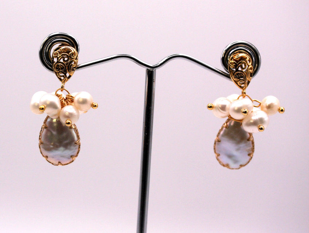 Genuine freshwater pearls. 14 mm teardrop baroque pearl with gold plated embellisments.