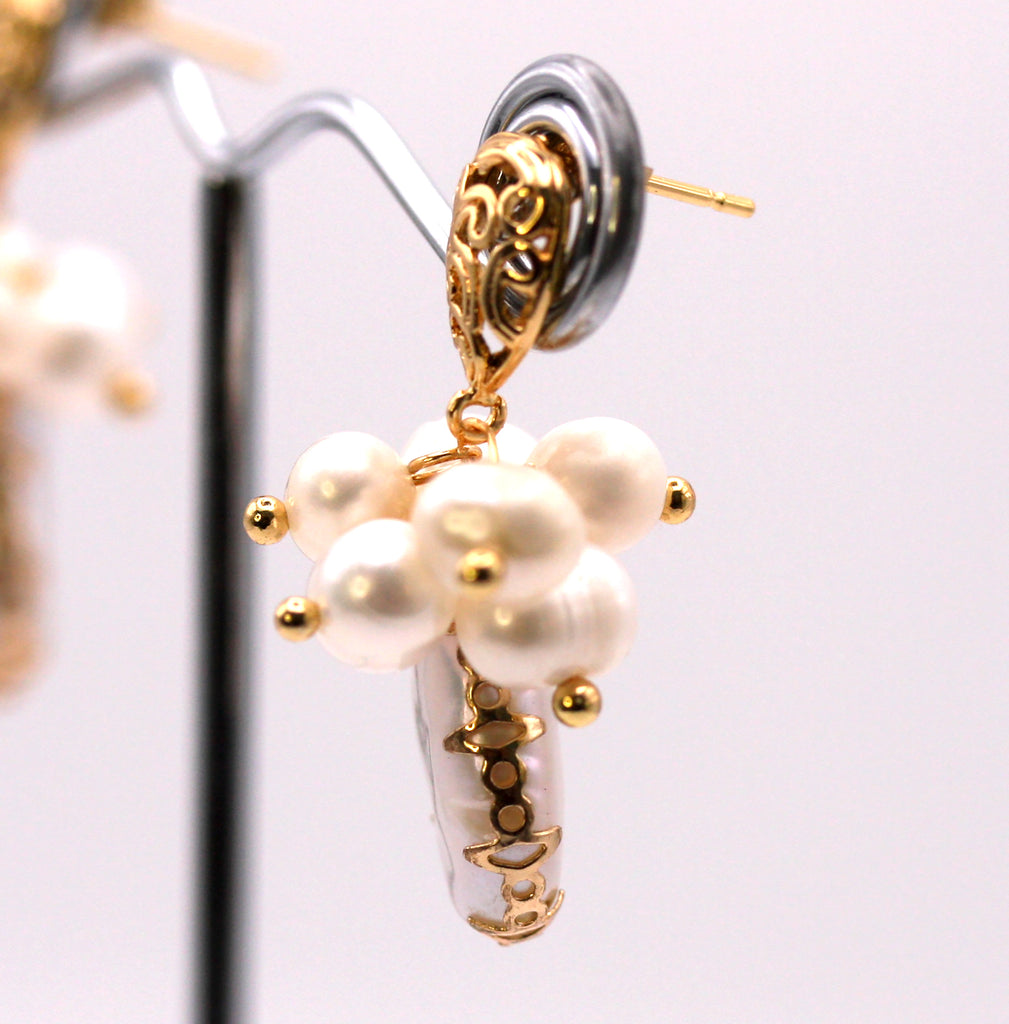 Genuine freshwater pearls. 14 mm teardrop baroque pearl with gold plated embellisments. Side view