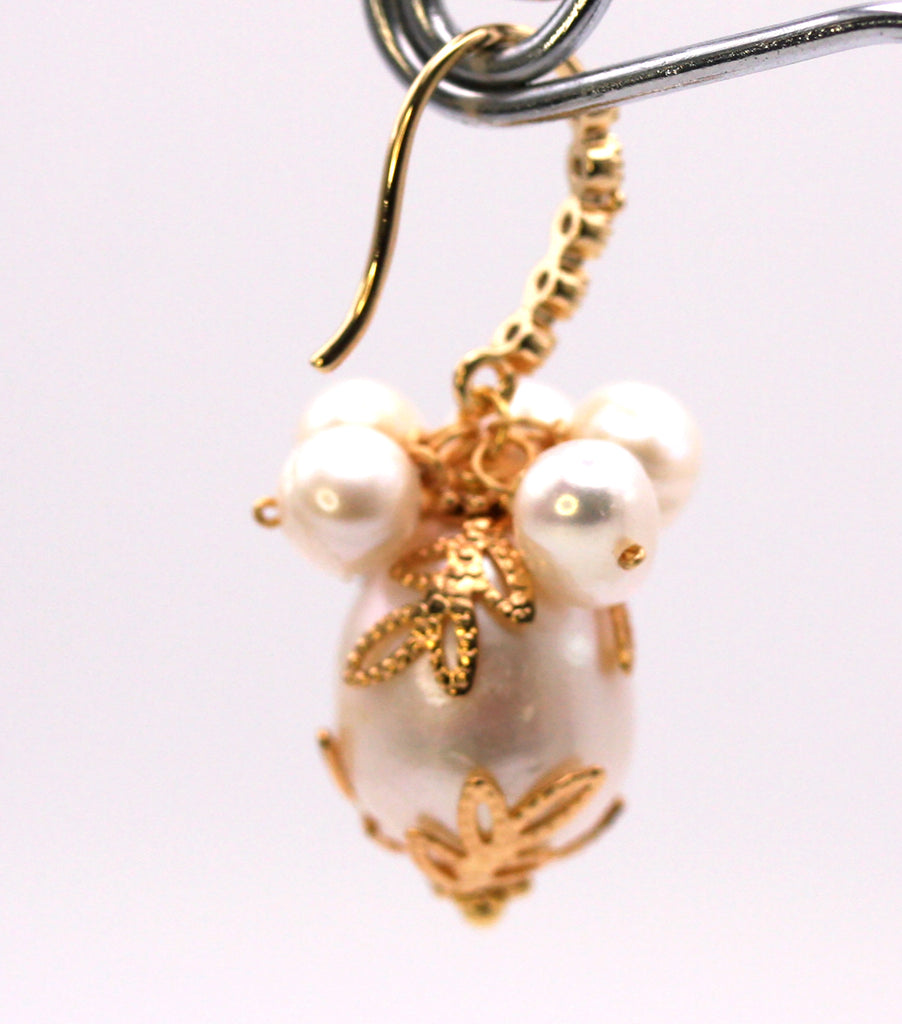 Women's Gold Plated Sterling Silver Earrings with Dangling 16 mm decorated Baroque freshwater Pearls. The white pearl hangs at the bottom of a Sheppard hook pave set with zircon gemstones and a cluster of five 4 mm white pearls. Rear view