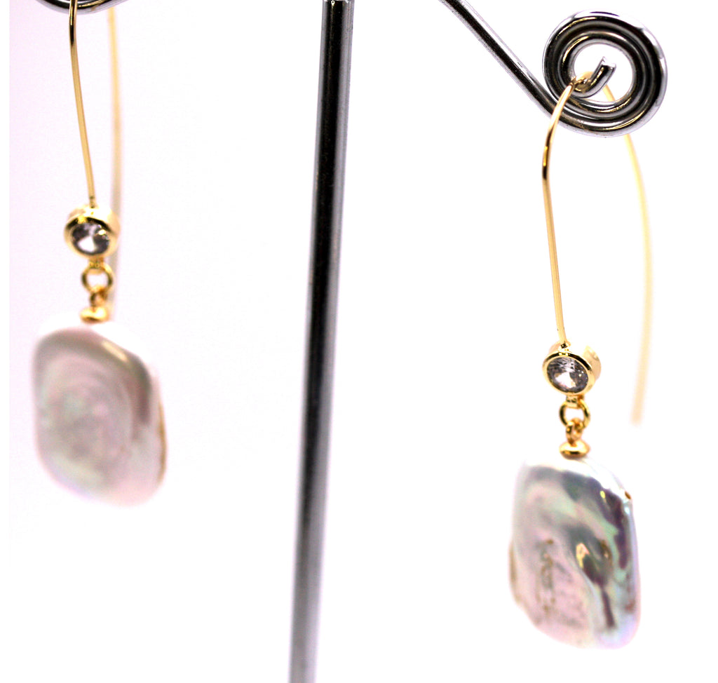 Women's Gold Plated Sterling Silver Earrings with Dangling 20 mm Rectangular freshwater Pearls. The white pearl hangs at the bottom of a thin Sheppard hook accented with a zircon gemstone. Side view