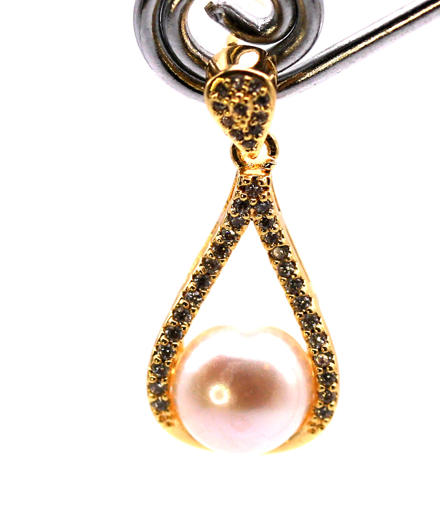 Women's Gold Plated Sterling Silver Earrings with freshwater Pearls. 8 mm white pearl in the centre of a tear drop ribbon pave set with clear zircon gemstones. Face view