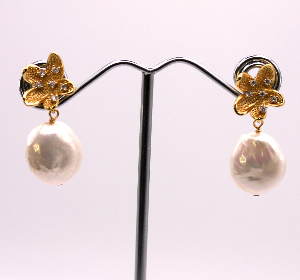 Women's Gold Plated Sterling Silver Earrings with Coin freshwater Pearls.  12 mm white coin pearl with a nice luster and smooth surface dangling below a flower pave set with five clear zircon gemstones. Top post.
