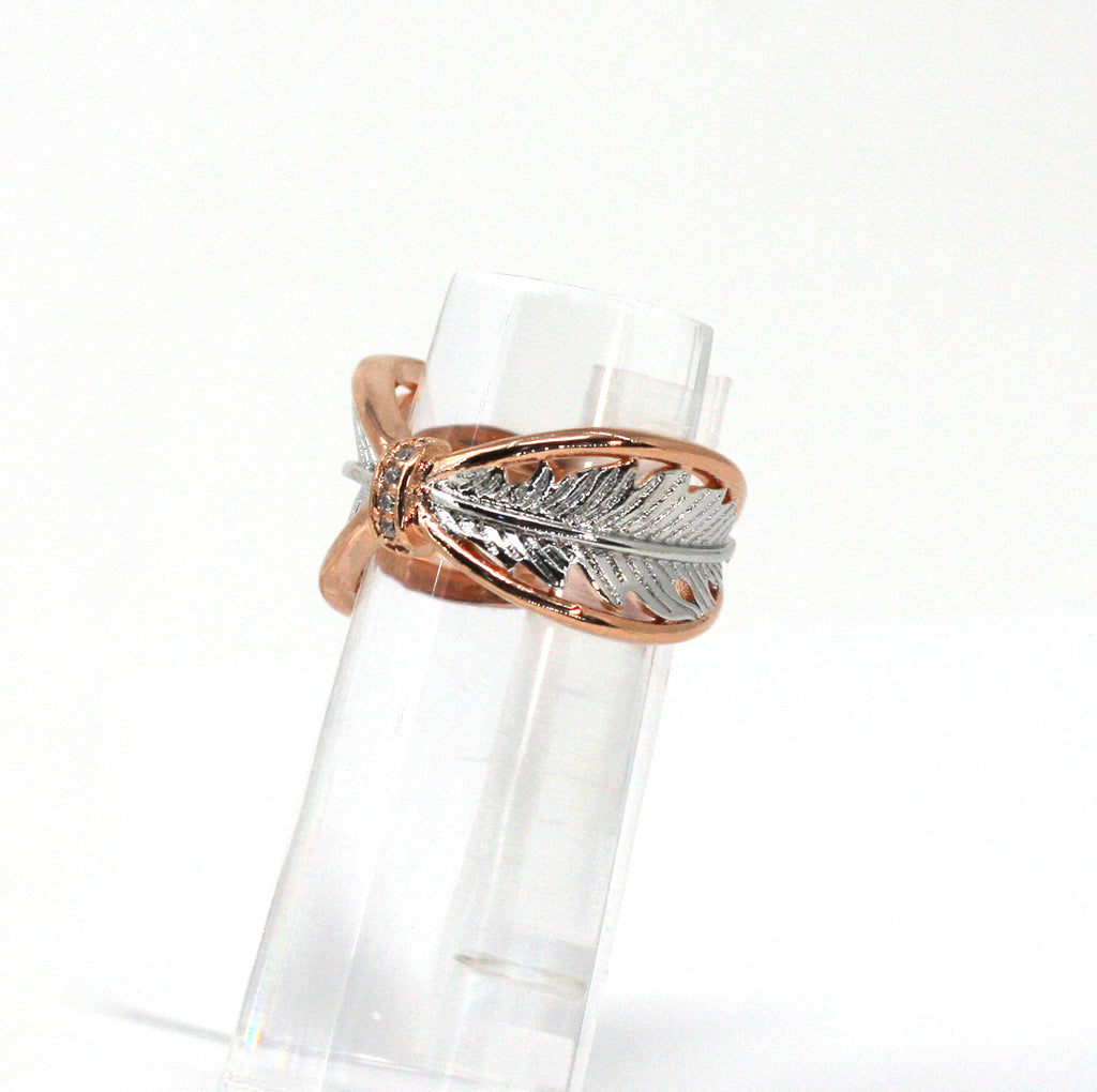 Rose Gold plated women's ring. Feather pattern and zircon gemstones