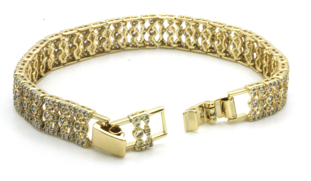 Women bracelet yellow gold plated with zircon gemstones. 7-inch length with a removable 1/2-inch extension. Open view