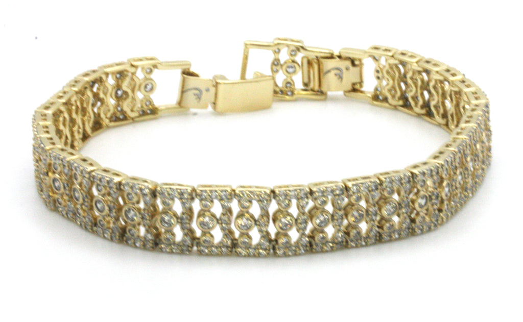 Women bracelet yellow gold plated with zircon gemstones. 7-inch length with a removable 1/2-inch extension.