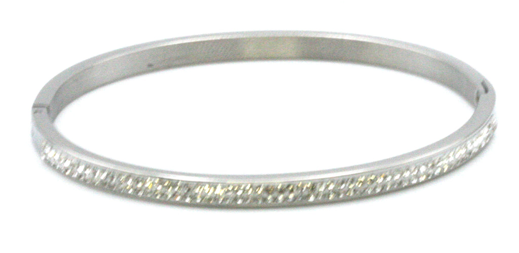 Women's bangle. This bracelet has a 7 1/4 inch diameter. With clear zircon gemstones.  available in yellow gold plating and silver/rhodium plating