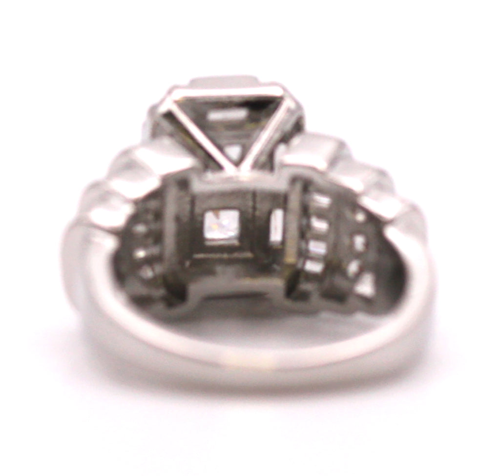 Sparkling women's ring in silver/rhodium plating. Terraced rows of clear zircon gemstones. Back view