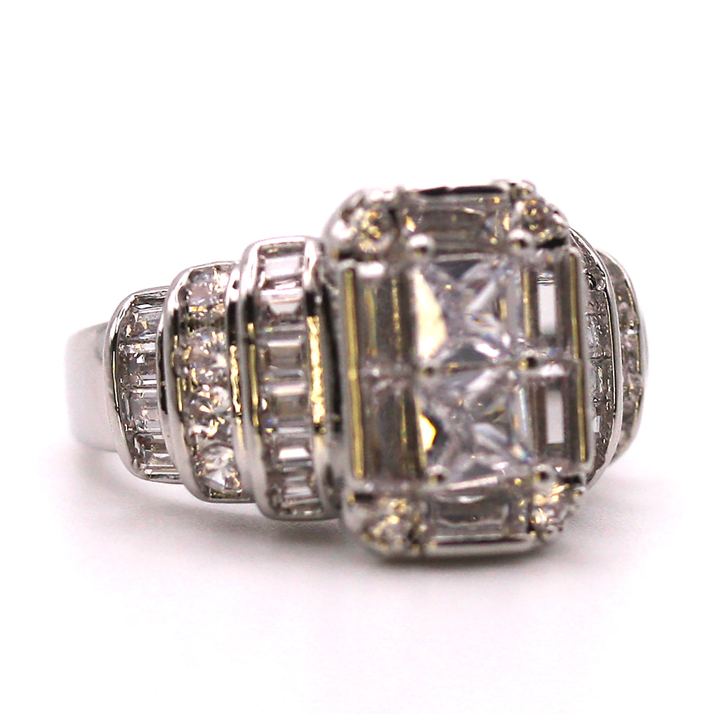 Sparkling women's ring in silver/rhodium plating. Terraced rows of clear zircon gemstones.