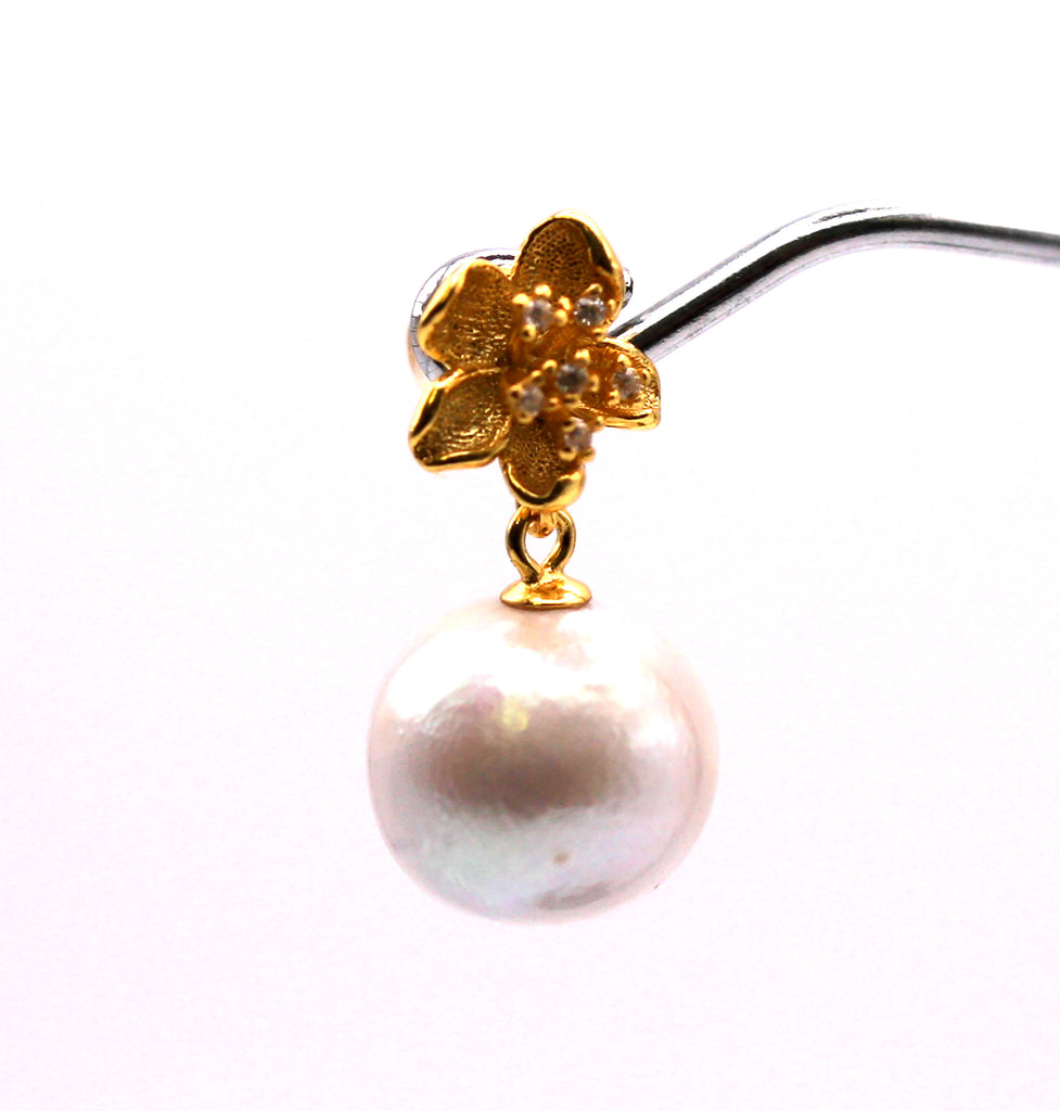 Genuine freshwater pearl. 10mm diameter. The top post is a gold plated sterling silver flower decorated with clear zircon gemstones. Front view