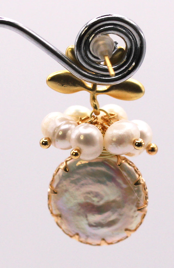 Women's Gold Plated Sterling Silver Earrings with Dangling 18 mm decorated Coin freshwater Pearls. The white pearl hangs at the bottom of a top post branch and leaves and a cluster of six 3 mm white pearls. Back view