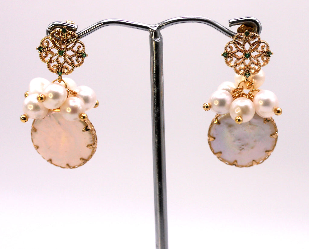 Women's Gold Plated Sterling Silver Earrings with Dangling 16 mm decorated Coin freshwater Pearls. The white pearl hangs at the bottom of a top post filigree flower set with five green zircon gemstones and a cluster of five 4 mm white pearls.