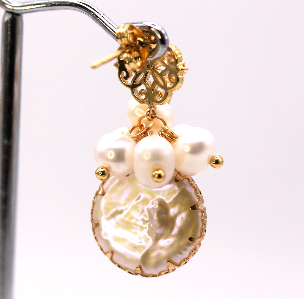 Women's Gold Plated Sterling Silver Earrings with Dangling 16 mm decorated Coin freshwater Pearls. The white pearl hangs at the bottom of a top post filigree flower set with five green zircon gemstones and a cluster of five 4 mm white pearls. Back view