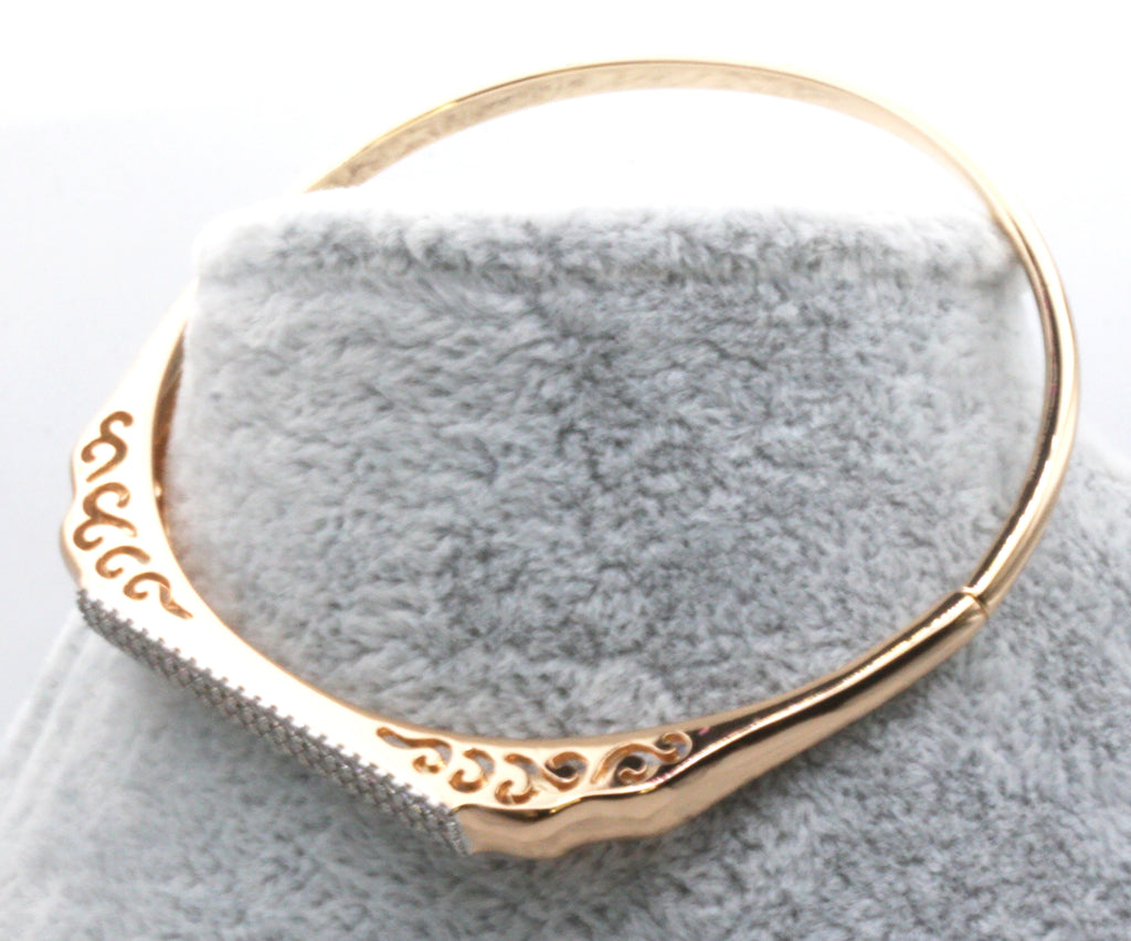 Women's bangle bracelet. Rose gold plated with a flat top pave set with clear zircon gemstones. 