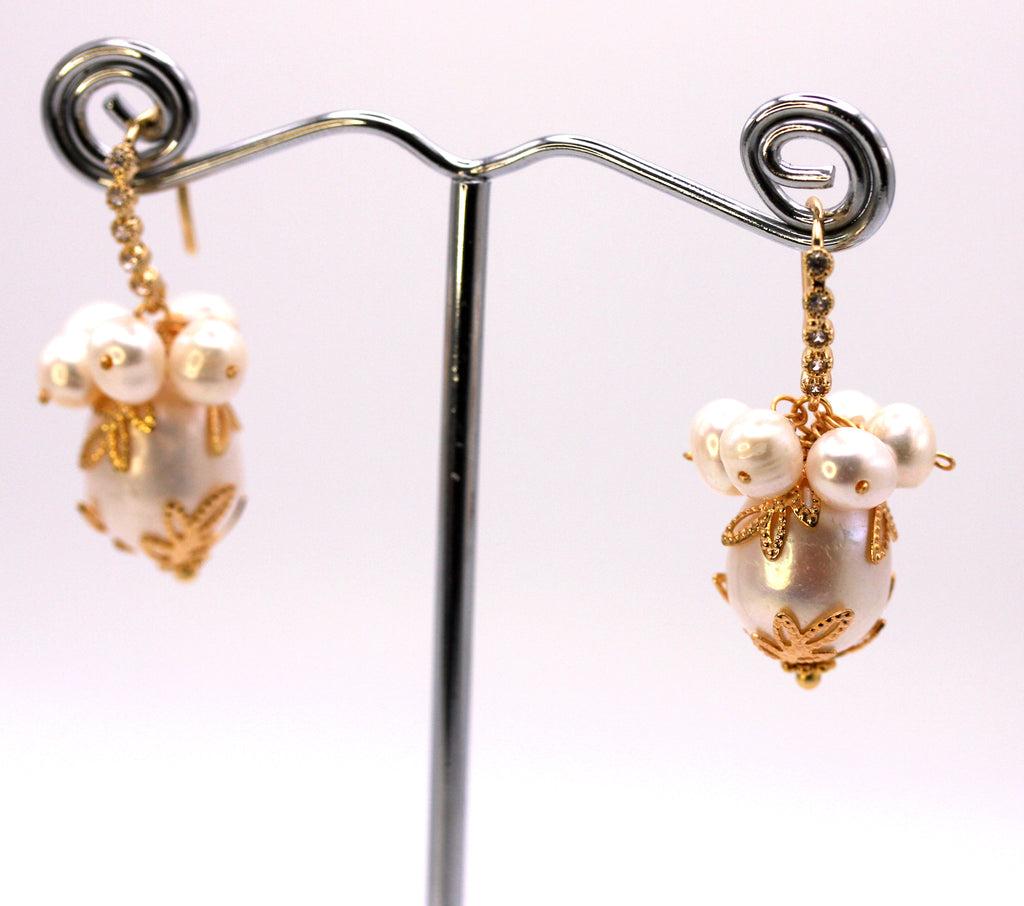 Women's Gold Plated Sterling Silver Earrings with Dangling 16 mm decorated Baroque freshwater Pearls. The white pearl hangs at the bottom of a Sheppard hook pave set with zircon gemstones and a cluster of five 4 mm white pearls.