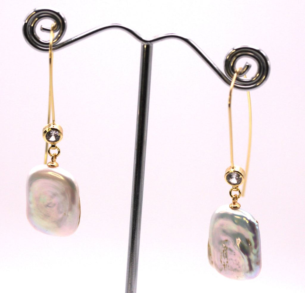 Women's Gold Plated Sterling Silver Earrings with Dangling 20 mm Rectangular freshwater Pearls. The white pearl hangs at the bottom of a thin Sheppard hook accented with a zircon gemstone.