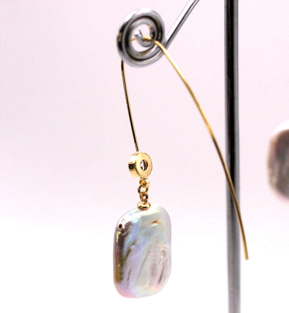 Women's Gold Plated Sterling Silver Earrings with Dangling 20 mm Rectangular freshwater Pearls. The white pearl hangs at the bottom of a thin Sheppard hook accented with a zircon gemstone. Back side view