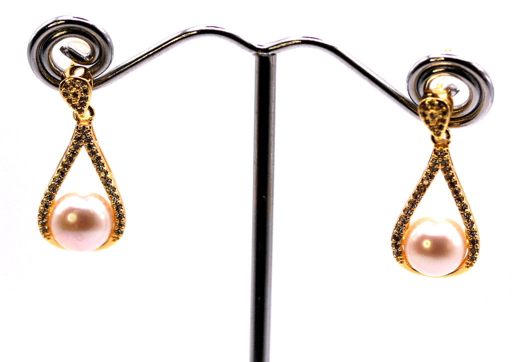 Women's Gold Plated Sterling Silver Earrings with freshwater Pearls. 8 mm white pearl in the centre of a tear drop ribbon pave set with clear zircon gemstones.