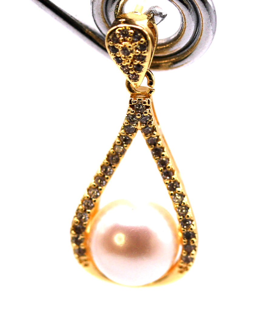 Women's Gold Plated Sterling Silver Earrings with freshwater Pearls. 8 mm white pearl in the centre of a tear drop ribbon pave set with clear zircon gemstones. Front view