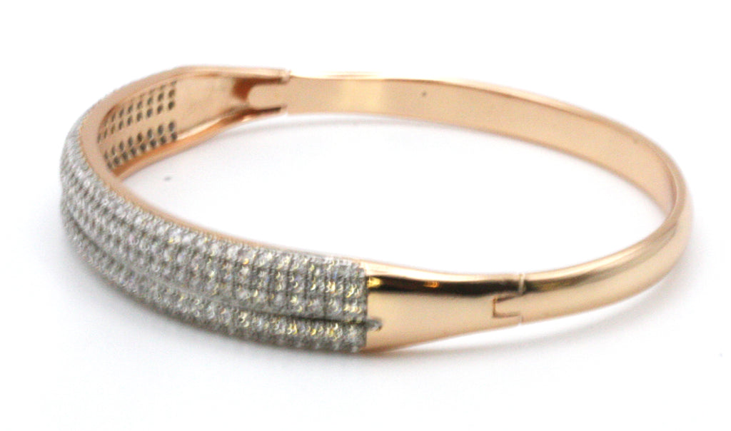 Women's bangle bracelet in rose gold plating featuring multi rows of pave set clear zircon gemstones