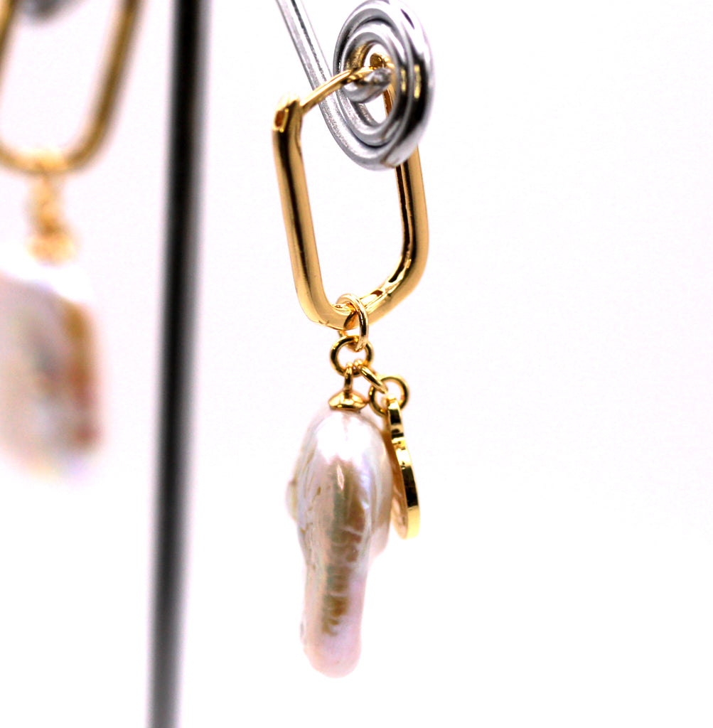 Women's Gold Plated Sterling Silver Earrings with freshwater dangling 20 mm rectangular pearl and small medallion. Lever back closure. Side view