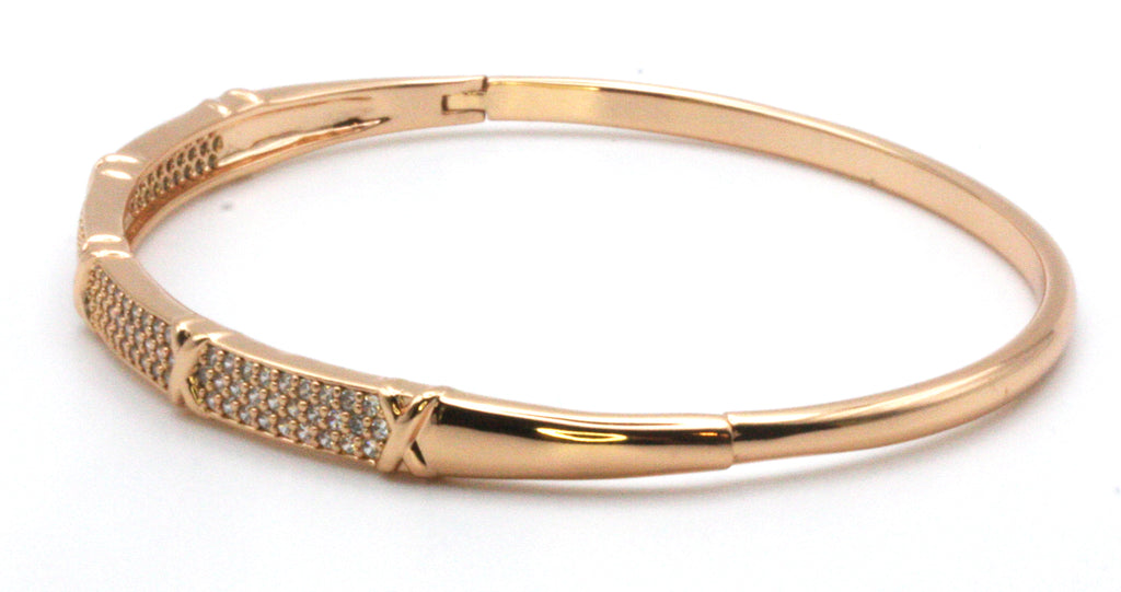Women's bangle bracelet in Rose Gold plating and pave set clear zircon gemstones