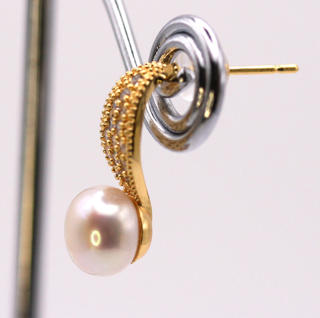 Women's Gold Plated Sterling Silver Earrings with freshwater Pearls. 8 mm white pearl on a dropped post decorated with pave set clear zircon gemstones.